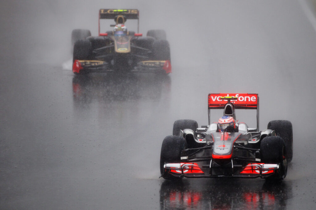 Jenson Button leads Vitaly Petrov in the 2011 Canadian GP.