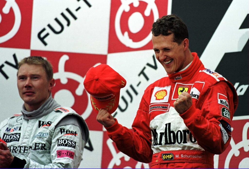 Schumacher wins third title at 2000 Japan GP with Ferrari.