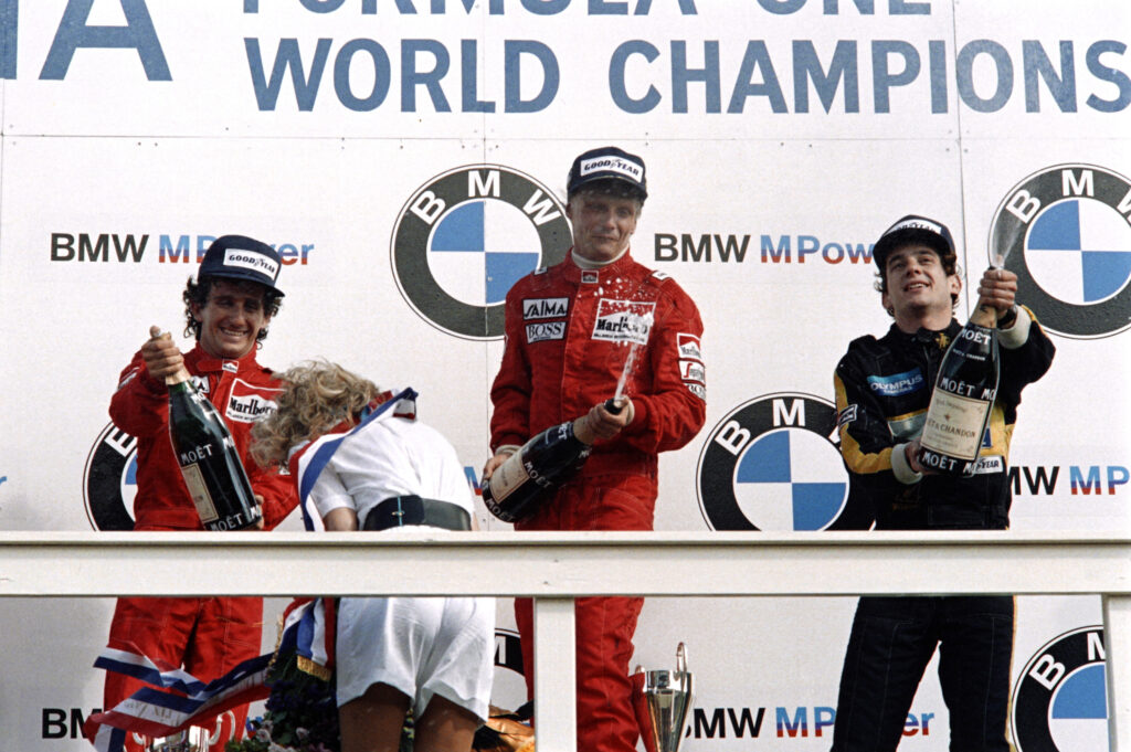 World champion Niki Lauda (C) of Austria