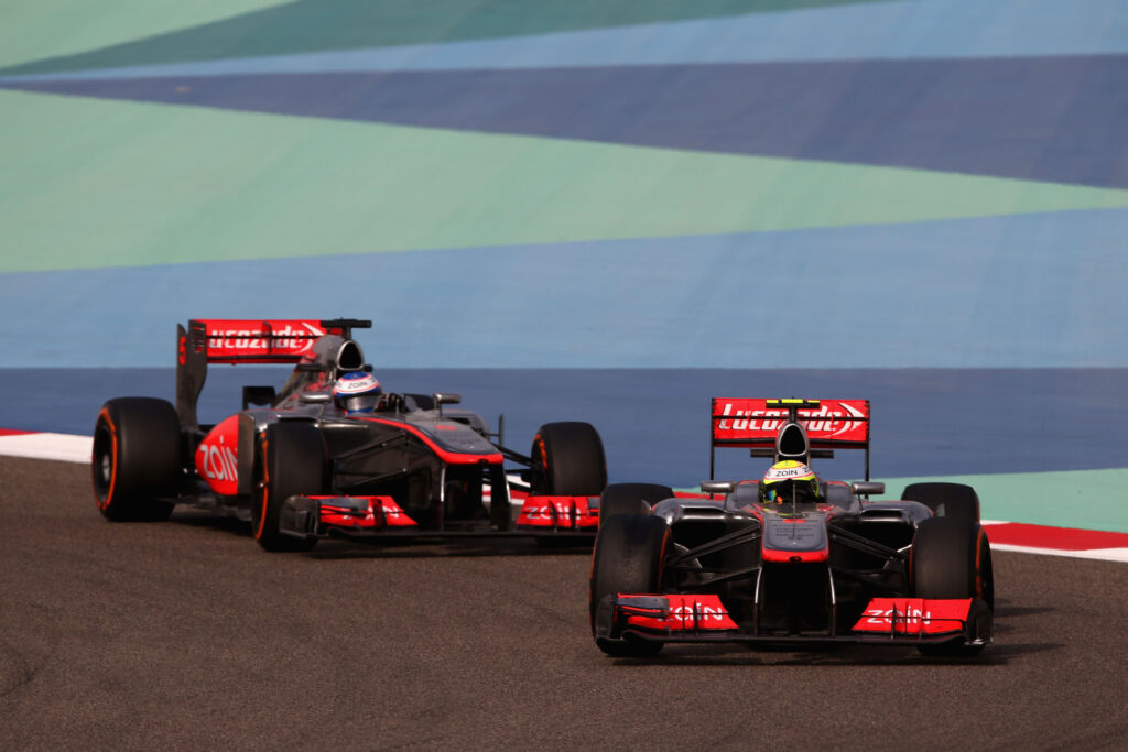 Sergio Perez leads Jenson Button at the 2013 Bahrain Grand Prix.