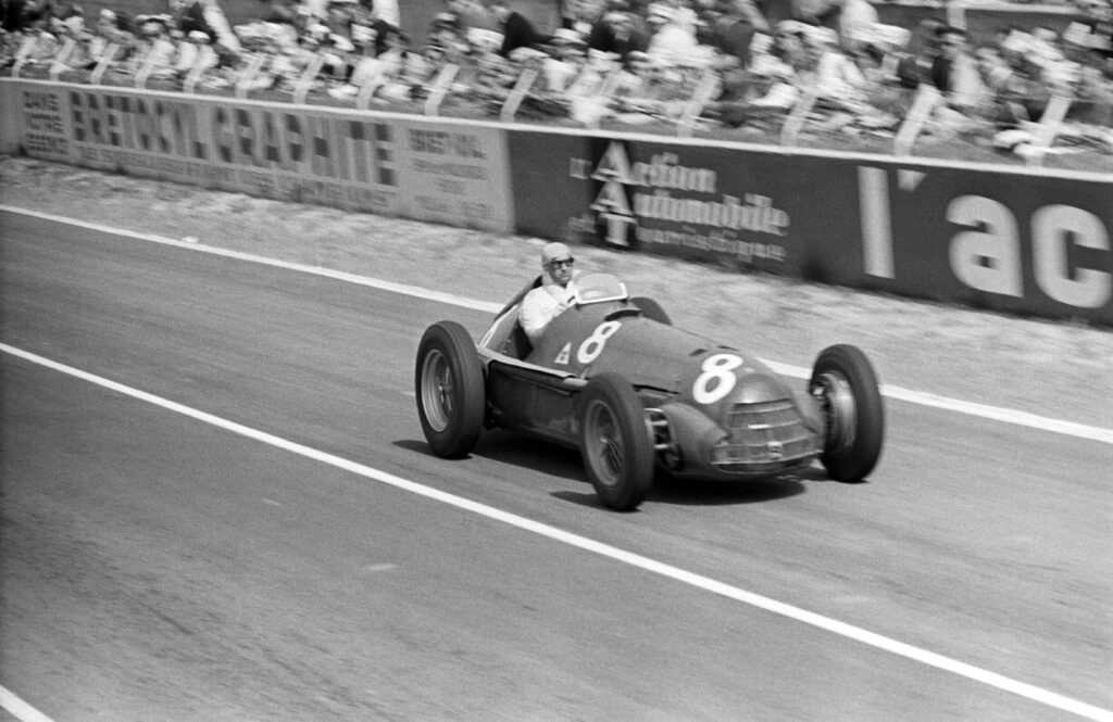 Juan Manuel Fangio driving an Alfa Romeo Alfetta.