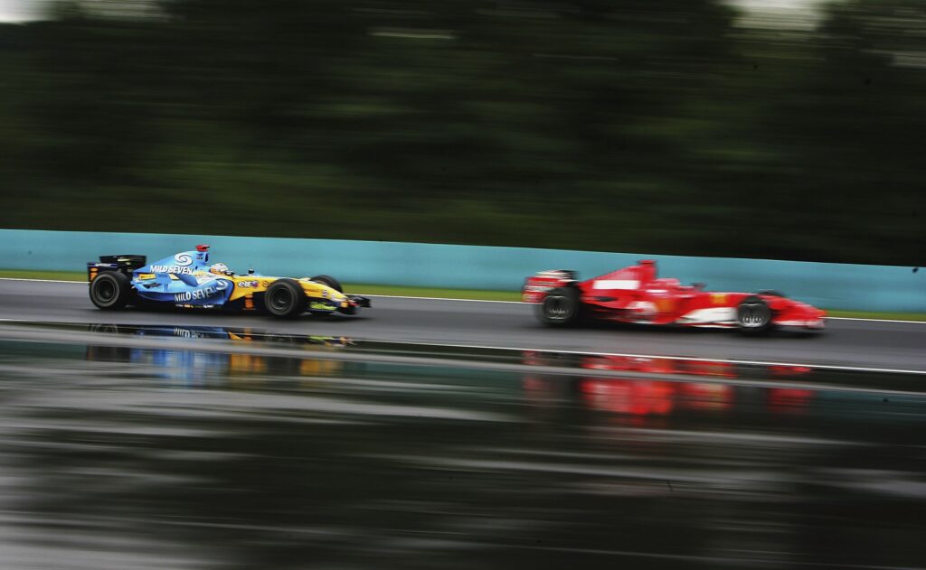 Fernando Alonso chases Michael Schumacher during the 2005 Hungarian GP.