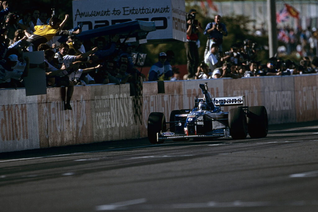 Damon Hill secures 1996 title at Japanese Grand Prix.